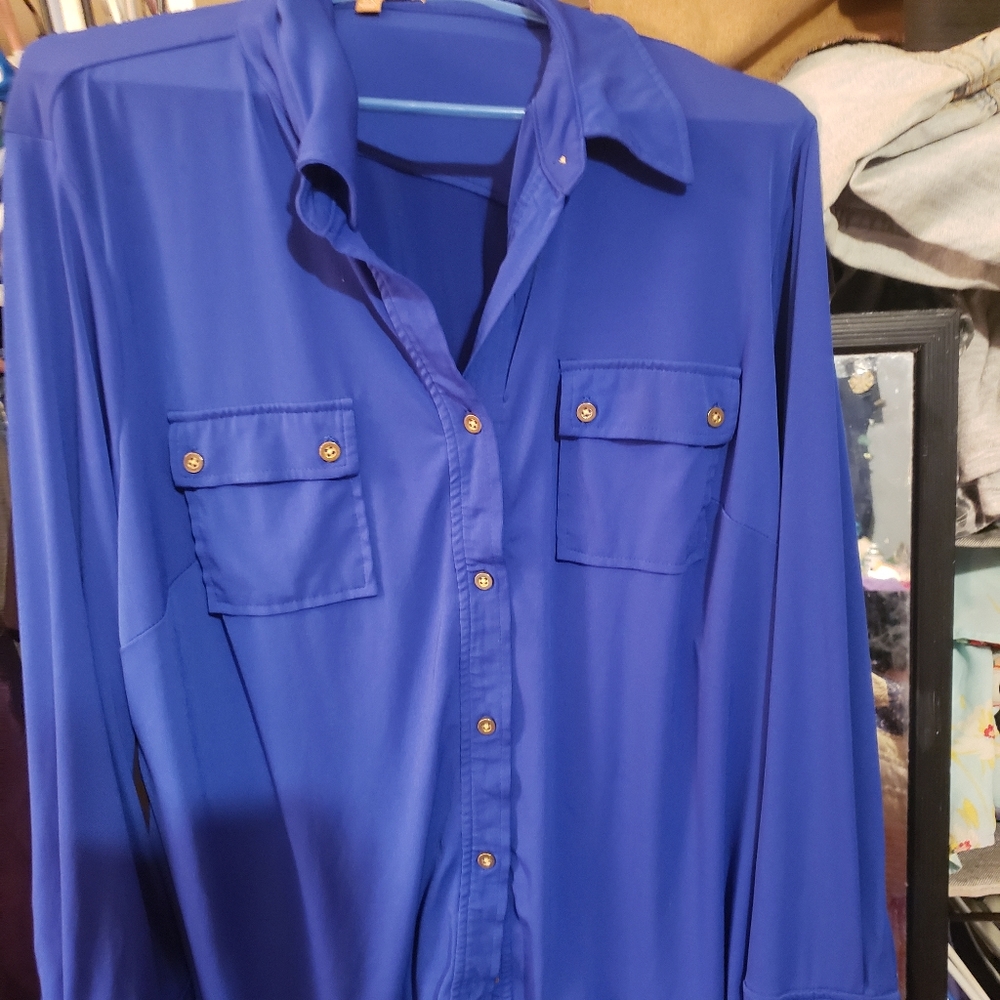 Blue button down dress shirt  material is silky so